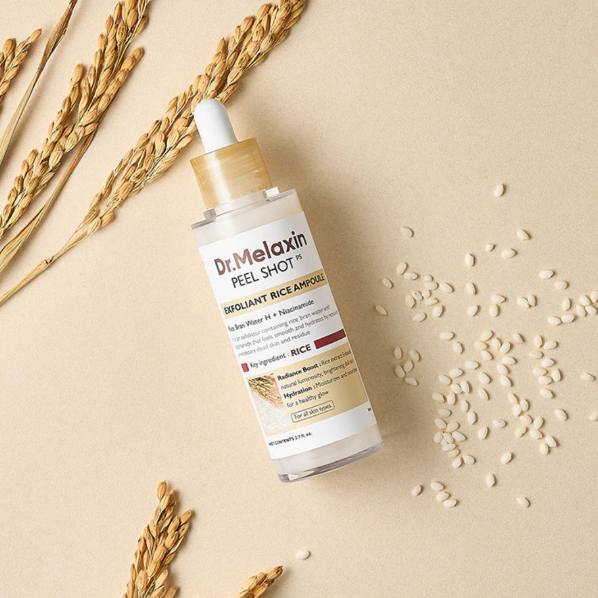 Dr. Melaxin peel shot bottle with rice grains and wheat stalks on a beige background
